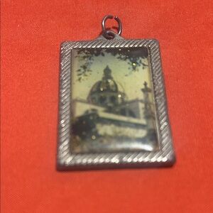 Used Silver Framed Dome Pendant of the mission in Christ on the back